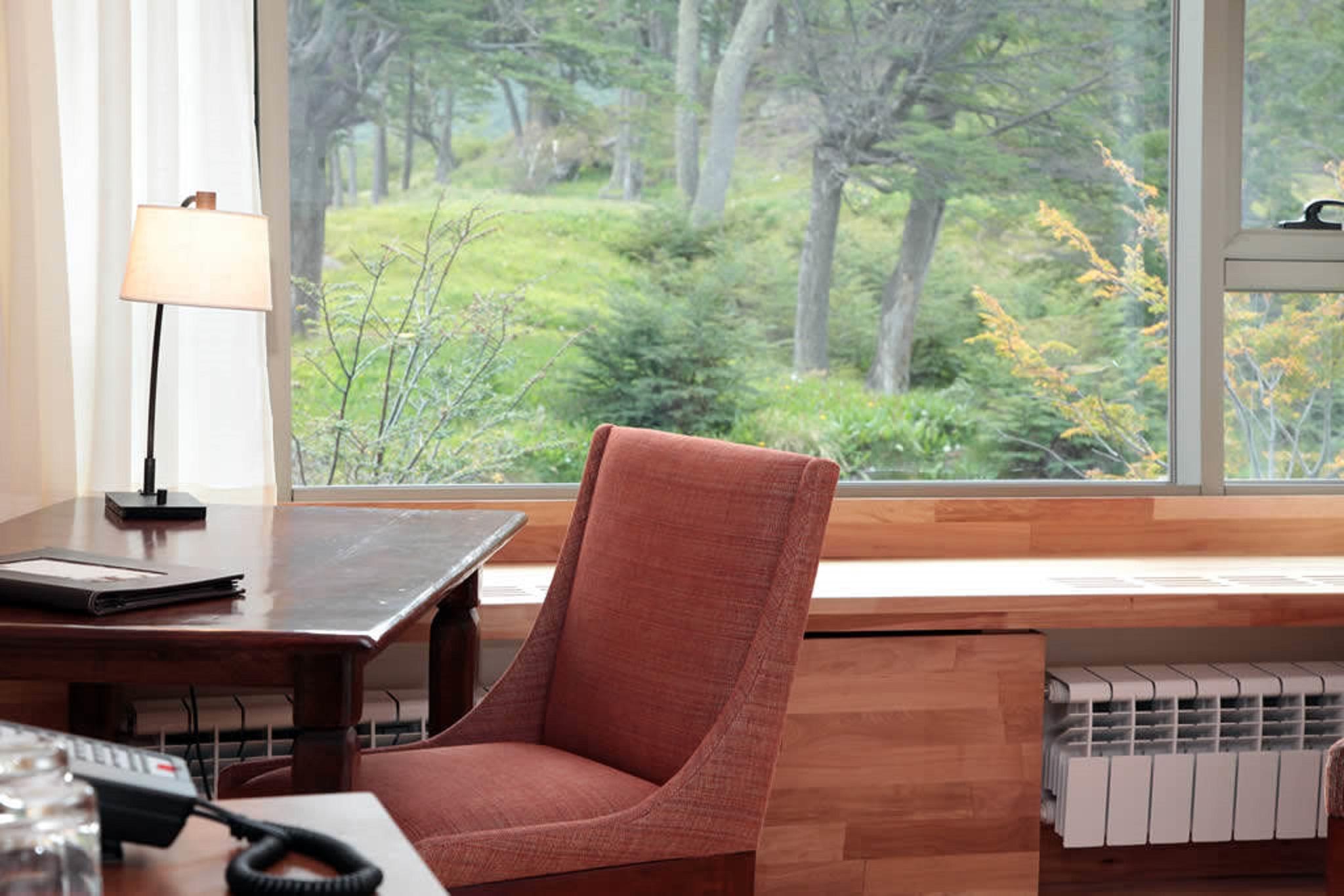 Arakur Ushuaia Resort & Spa Eksteriør billede A view of the woods from the library